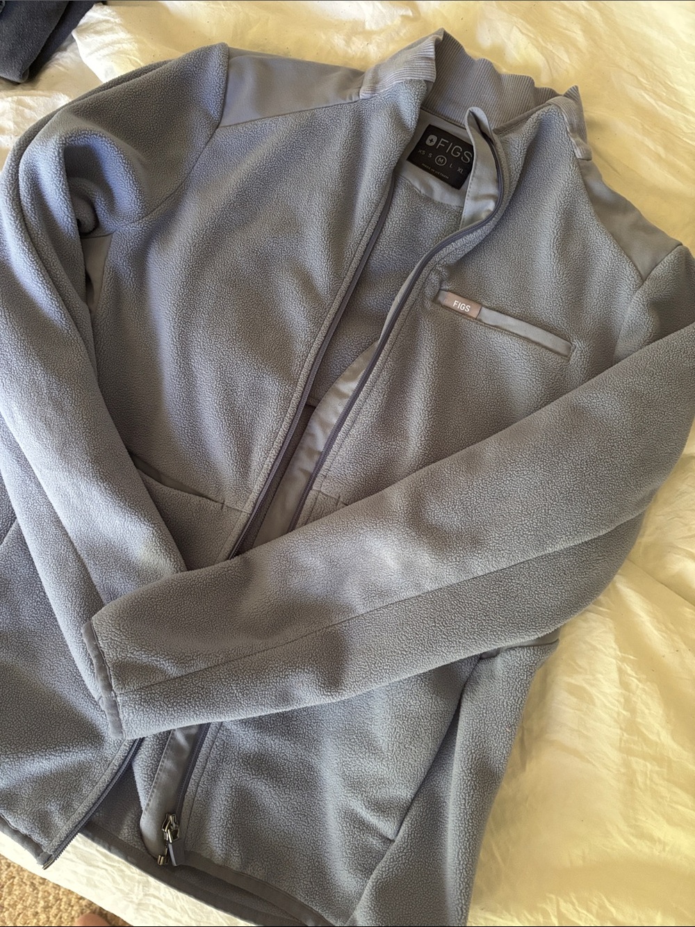 FIGS Woman’s Light Blue Fleece Jacket with Chest Pocket